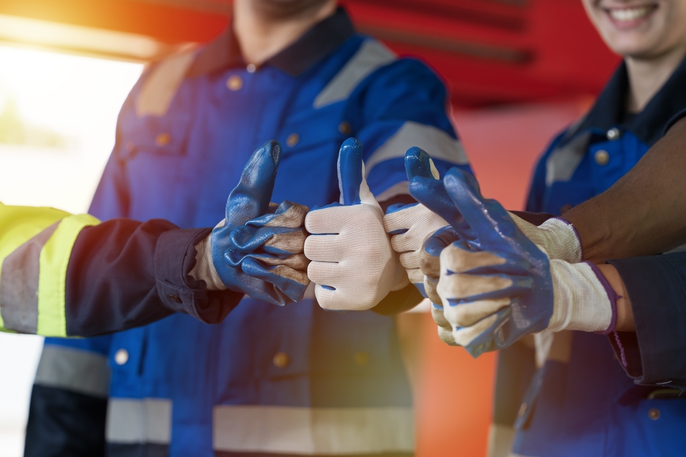 Group,Of,Male,And,Female,Factory,Workers,Standing,Putting,Their